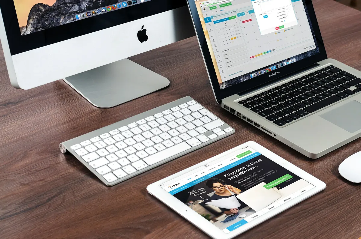 Raycast vs Spotlight 2026 — MacBook desk workspace